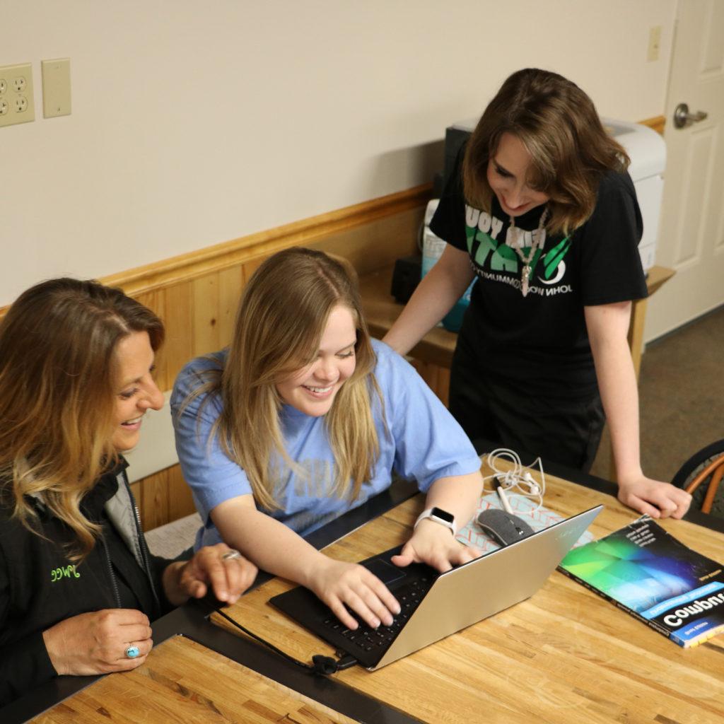 Students working together in the SEC conference room